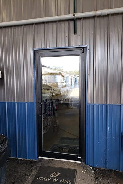 glass door in shop Reeder Trausch Marina