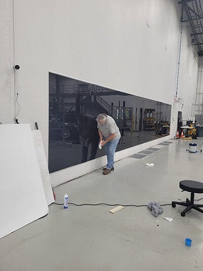 install crew checking seams of panels